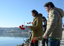 Baku residents bringing flowers to Seaside Boulevard to honor missing oil workers.  Azerbaijan, Dec.07, 2015